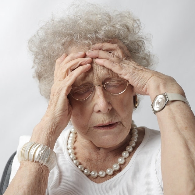 senior-woman-having-a-headache-640