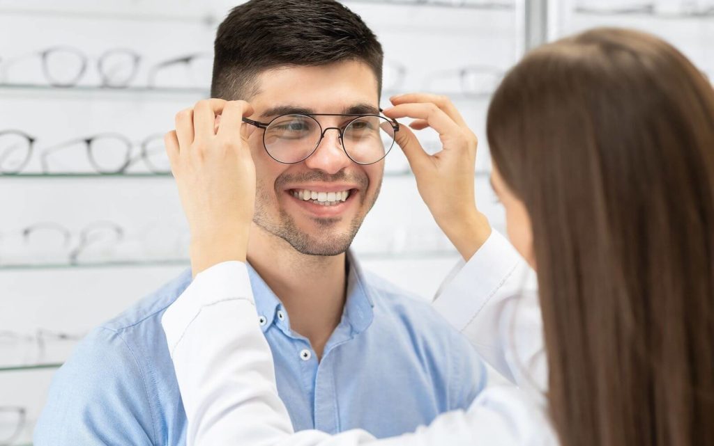 happy-man-trying-on-a-new-pair-of-eyeglasses-hero-1024x641-1